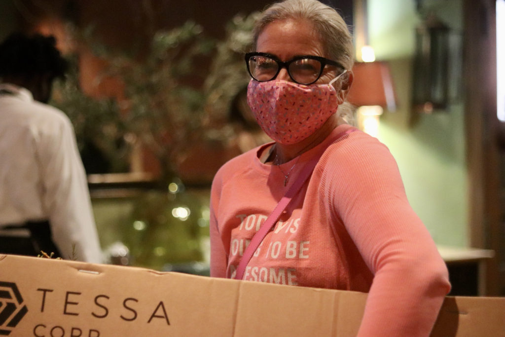 woman in pink shirt and pink mask